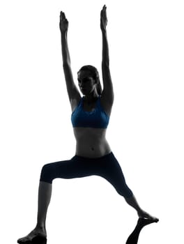 one caucasian woman exercising yoga in silhouette studio isolated on white background