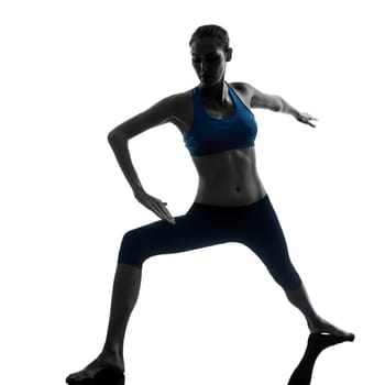 one caucasian woman exercising yoga in silhouette studio isolated on white background