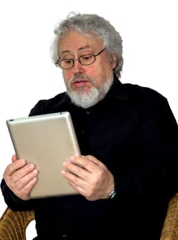 A senior with grey hair is holding a tablet and looking at it helpless