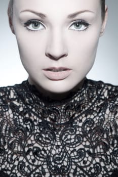 Beautiful young woman with evening dress and perfect makeup