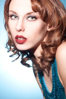 Beautiful young woman with brunette curls and perfect makeup