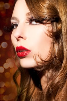 Beautiful young woman with long eyelashes and healthy hair
