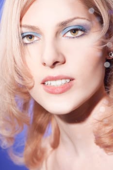 Beautiful young woman with blond hair and bright smile