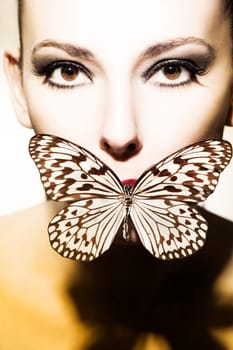 Face of a beautiful,young woman with butterfly