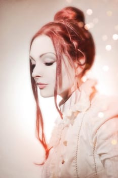 Beautiful young woman with pinned-up,long,red hair
