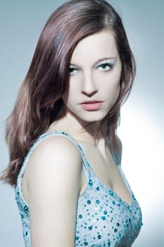 Beautiful young woman with healthy,shiny hair and makeup