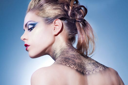 Beautiful young woman with exciting makeup and beautiful hairstyling