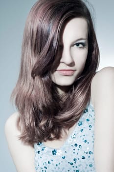 Beautiful young woman with healthy,shiny hair and makeup