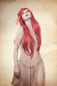 Young beautiful woman with long red hair