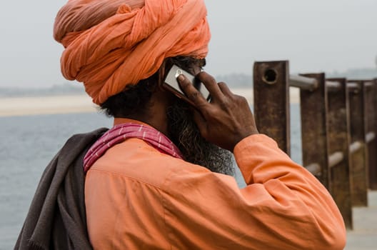 Indian man with turban talks to the jail cell