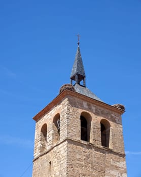 Nest stork on the bell tower church