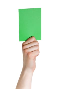a hand holding a green tag, voting or electing, isolated