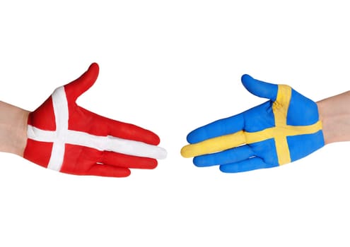 two hands symbolizing denmark and sweden in handshake gesture