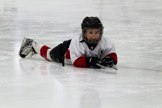 Child playing ice hockey