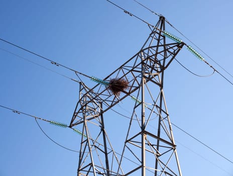 A stork nest on an electricity pylon, Spain