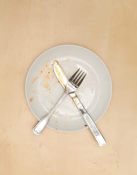 An empty dirty plate,  View from above