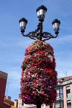 Flower decoration on a street light in Gijon, Asturias