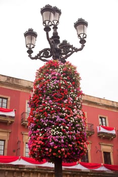 Flower decoration on a street light in Gijon, Asturias