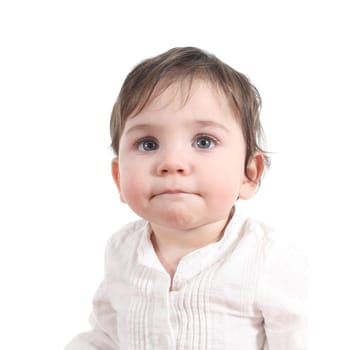 Baby watching attentive with a big blue eyes in a white isolated background