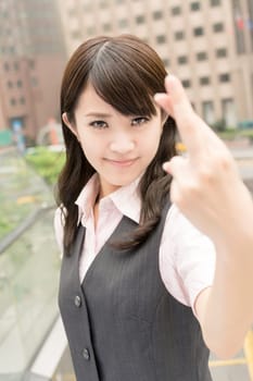 Business woman cross finger with cheat sign, closeup portrait in city.