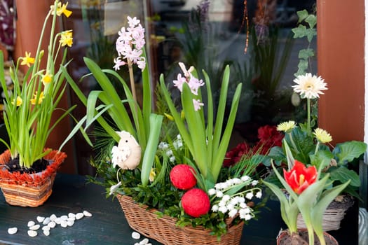 hyacinths and narcissus with happy Easters decoration on a window