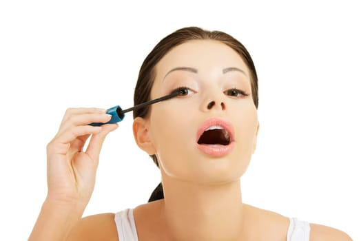 Close up of woman face with mascara brush