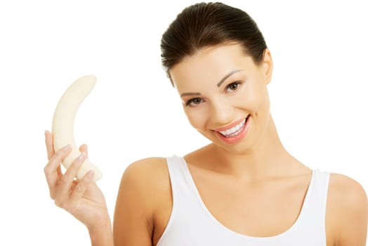 Attractive fit woman eating banana, isolated on white