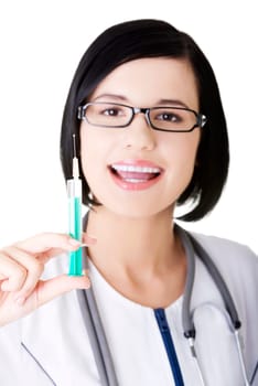 Young happy female doctor or nurse holding syringe