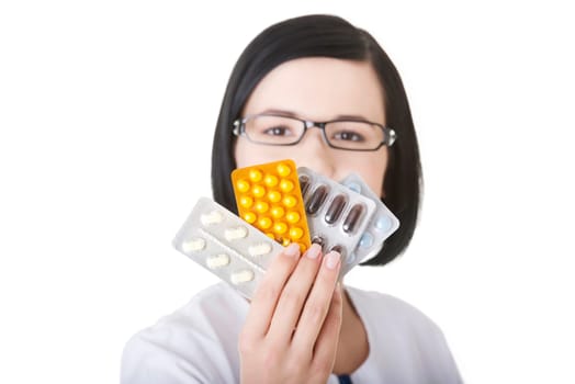 Portrait of beautiful doctor or nurse holding prescription drugs isolated over white background