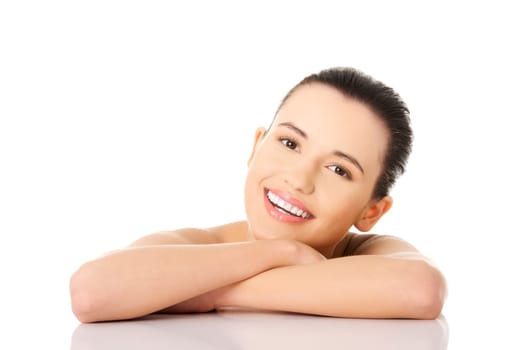 Portrait of a beautiful happy female model on white background