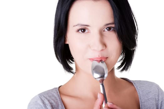 Young smiling woman with spoon (pleasure from eating), isolated on white