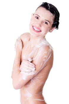 Young fit happy woman in shower washing her body