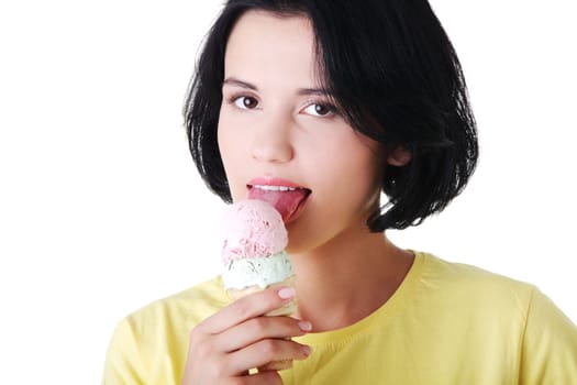 Young woman eating ice cream, isolated on white