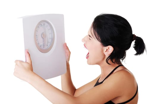 Frustrated woman with scale, isolated on white