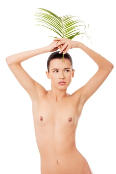 Portrait of young beautiful woman with green exotic leaf