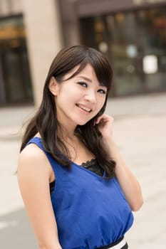 Asian beauty in daytime in modern street in Taipei, Taiwan, Asia.