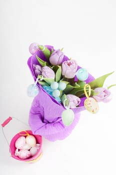 Top view to easter eggs and bouquet