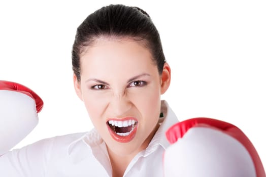 Young businesswoman with boxing gloves, isolated on white background