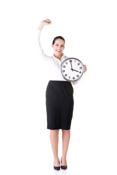 Happy young business woman holding office clock, isolated on white background