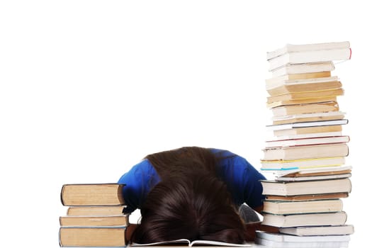 Teenage girl studying at the desk being tired, isolated on white