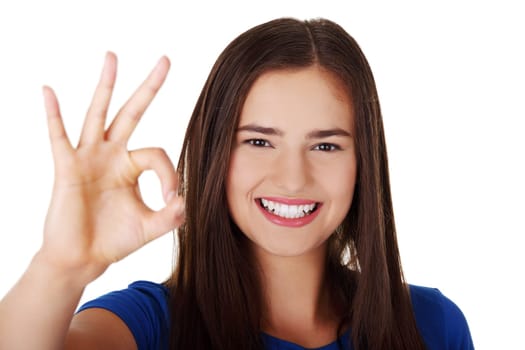 Happy teen girl gesturing perfect, isolated on white
