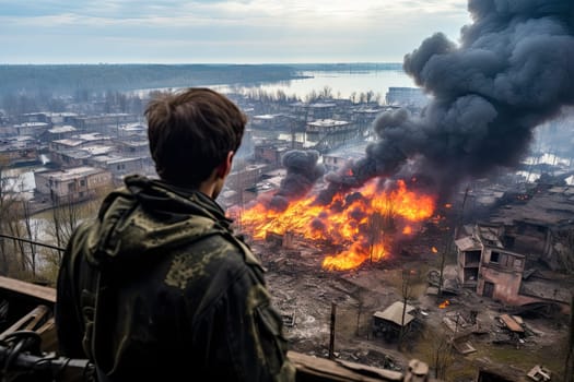 a person standing on a balcony looking at a large fire burning in the distance and buildings that are being destroyed
