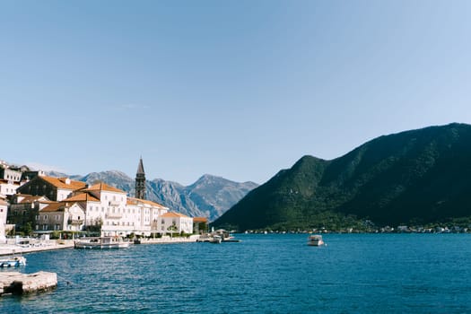 Boats are moored at the pier of the old town. Perast, Montenegro. High quality photo