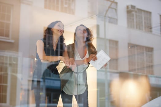 Happy, talking and women at a gallery for art, exhibition or looking at paintings together. Smile, communication and friends or people at a museum for culture, creativity or thinking of collection.