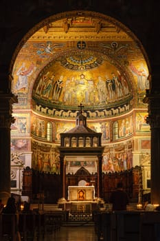 Rome, Italy, August 17, 2008: Head and main altar of the Basilica of Santa Maria in Trastevere. Mosaics in the apse