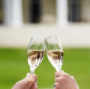 Couple, married and hands with champagne in celebration of anniversary, success or retirement. Mature, man and woman with toast, drink or cheers at hotel for love, romance or quality time in bond.