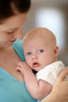 Calm, baby and portrait with mother holding newborn in home for bonding together. Infant, face and mom carrying curious child in arms to relax in house with love, care and support with mommy.