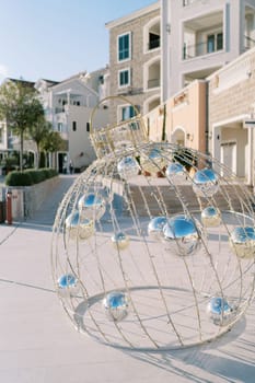 New Year installation in the form of a Christmas ball with mirror spheres inside. High quality photo