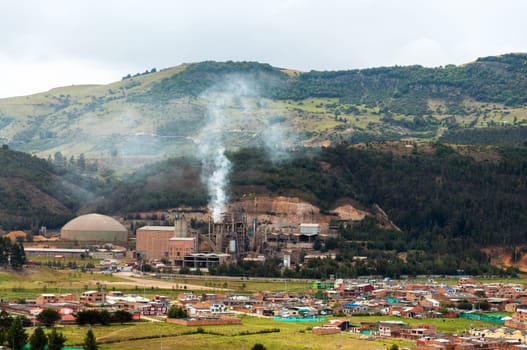 A factory producing pollution near a small town