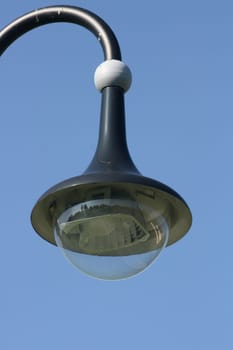 Street lamp with large umbrella,blue sky in the background